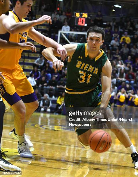 Siena's Brett Bisping drives to the basket during the Albany Cup basketball game against University at Albany at UAlbany on Sunday, Nov. 27, 2016 in...