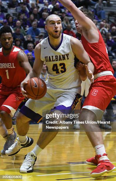 University at Albany's Greig Stire drives to the hoop during a basketball game against Cornell at the SEFCU Arena on Monday, Jan. 2, 2017 in Albany...