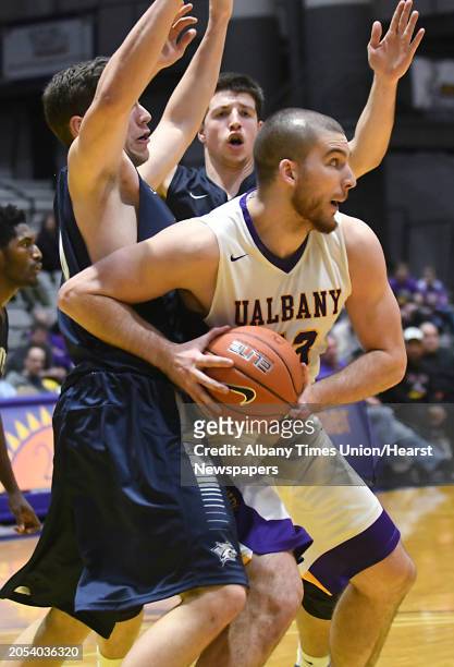 University at Albany's Greig Stire tries to make a move to the basket during a basketball game against New Hampshire at SEFCU Arena on Wednesday,...