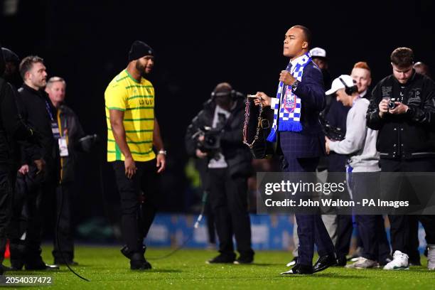 Boxer Fabio Wardley and Frazer Clarke in a Norwich City shirt during a face off at half time in the Sky Bet Championship match at Portman Road,...