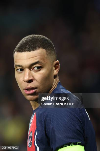 Paris Saint-Germain's French forward Kylian Mbappe looks backwards during the UEFA Champions League last 16 second leg football match between Real...