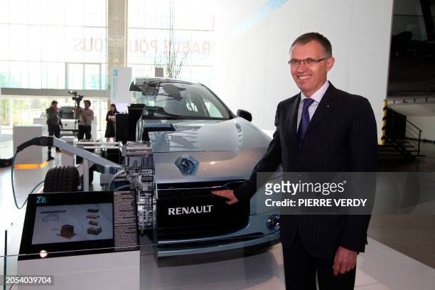 French car maker Renault General Director, Portugese Carlos Tavares, poses on July 28, 2011 in front of The Fluence ZE electric car which will be...