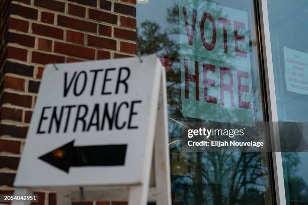 Signs directing voters are seen ouside a polling place on March 5, 2024 in Mountain Brook, Alabama. 15 States and one U.S. Territory hold their...