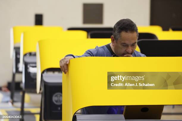 Boyle Heights, CA A voter casts his ballot during Super Tuesday primary election at the Boyle Heights Senior Center in Boyle Heights Tuesday, March...