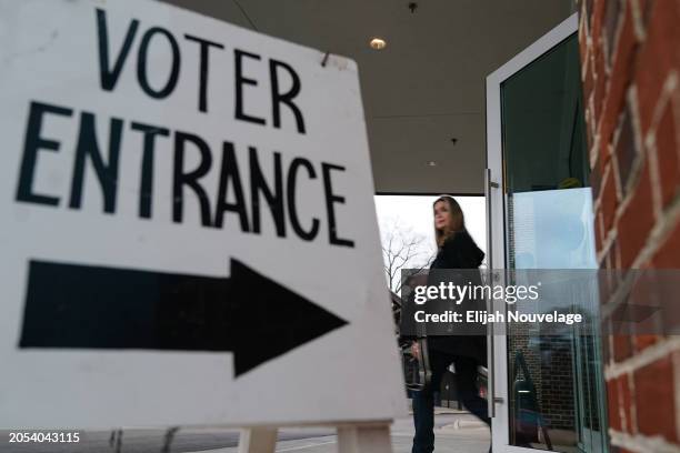 Voter leaves a polling place after casting their ballot in the state's primary on March 5, 2024 in Mountain Brook, Alabama. 15 States and one U.S....
