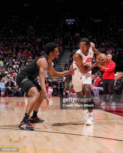 Herb Jones of the New Orleans Pelicans plays defense during the game against Immanuel Quickley of the Toronto Raptors on March 5, 2024 at the...