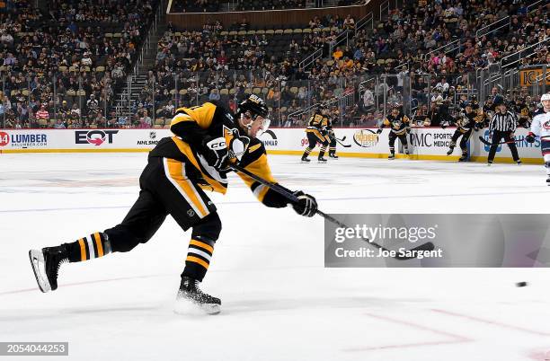 Evgeni Malkin of the Pittsburgh Penguins shoots and scores in the first period against the Columbus Blue Jackets at PPG PAINTS Arena on March 5, 2024...