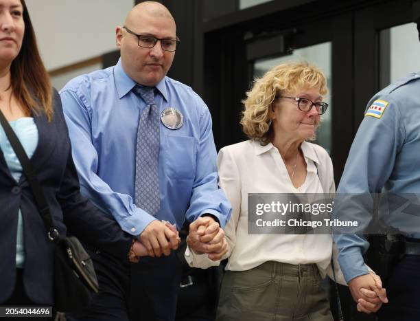 Chicago police Officer Carlos Yanez Jr., center left, and Elizabeth French, mother of slain Chicago police Officer Ella French, center right, exit...