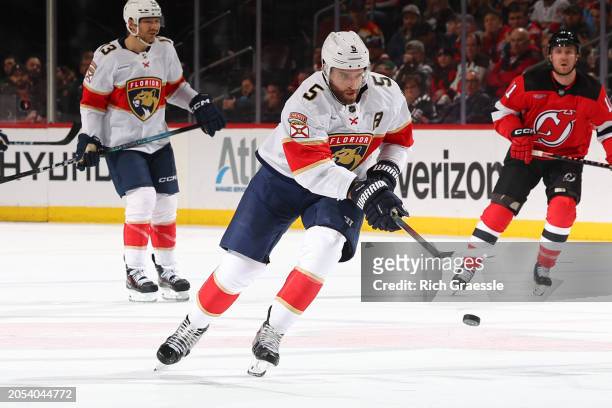 Aaron Ekblad of the Florida Panthers skates in the third period of the game against the New Jersey Devils at the Prudential Center on March 5, 2024...