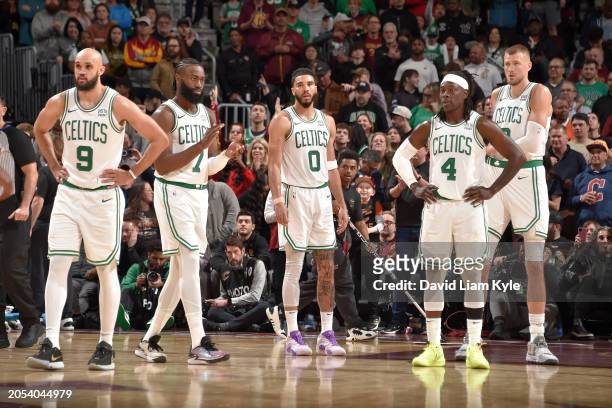 The Boston Celtics huddle up during the game against the Cleveland Cavaliers on March 5, 2024 at Rocket Mortgage FieldHouse in Cleveland, Ohio. NOTE...