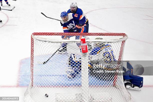 Kyle Palmieri of the New York Islanders scores a goal past Joel Hofer of the St. Louis Blues during the second period at UBS Arena on March 05, 2024...