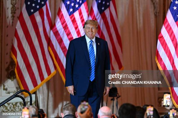 Former US President and 2024 presidential hopeful Donald Trump arrives to speak during a Super Tuesday election night watch party at Mar-a-Lago Club...