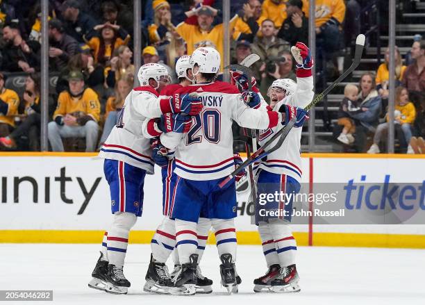 The Montreal Canadiens celebrate a goal against the Nashville Predators during an NHL game at Bridgestone Arena on March 5, 2024 in Nashville,...