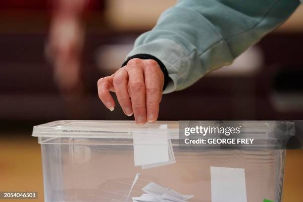 Voter cast their choice for the Republican presidential candidate on a slip of paper during the Republican Caucasus at Wasatch Elementary school in...