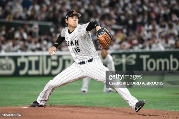 This photo taken on March 16, 2023 shows Japan's Shohei Ohtani pitching during the World Baseball Classic quarter-final game between Japan and Italy...