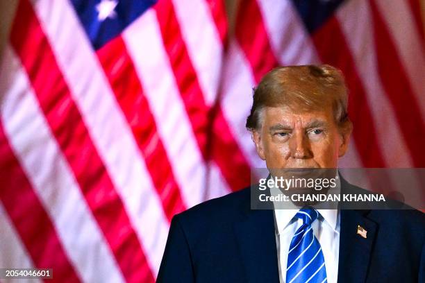 Former US President and 2024 presidential hopeful Donald Trump looks on during a Super Tuesday election night watch party at Mar-a-Lago Club in Palm...
