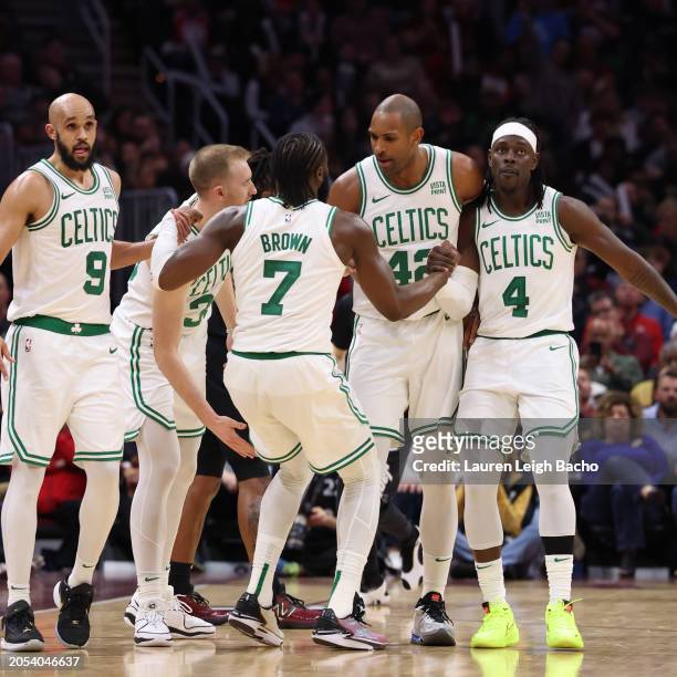 The Boston Celtics huddle up during the game against the Cleveland Cavaliers on March 5, 2024 at Rocket Mortgage FieldHouse in Cleveland, Ohio. NOTE...