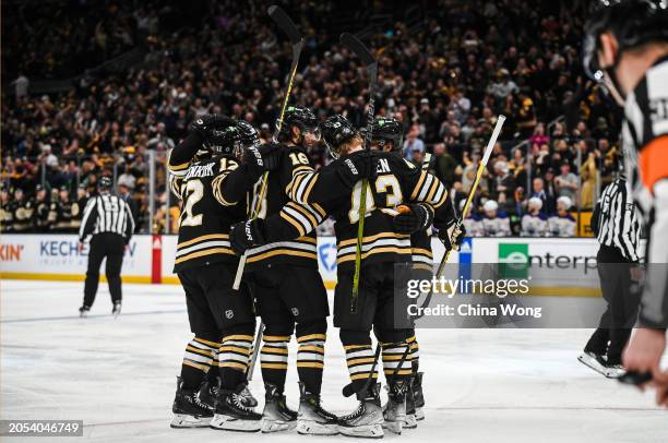 Pavel Zacha of the Boston Bruins celebrates his third period goal with David Pastrnak, Danton Heinen, and Kevin Shattenkirk against the Edmonton...