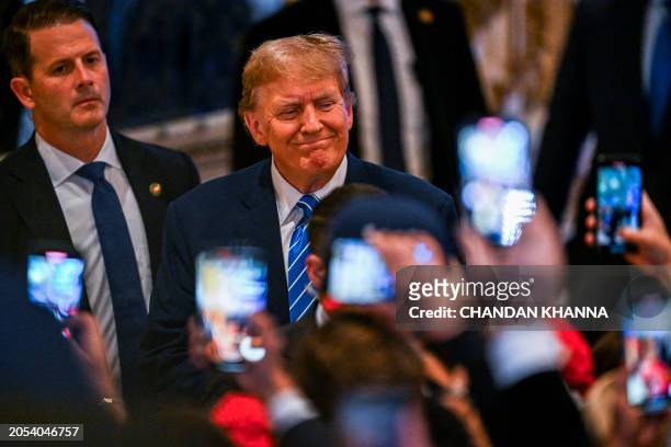 Former US President and 2024 presidential hopeful Donald Trump attends a Super Tuesday election night watch party at Mar-a-Lago Club in Palm Beach,...