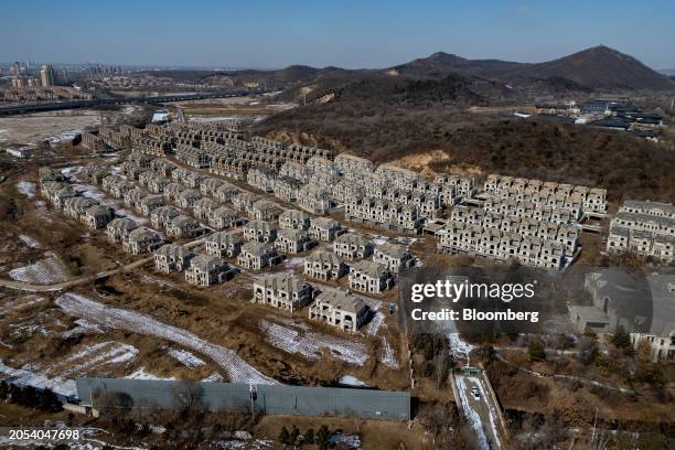 Uncompleted residential buildings at the State Guesthouse real estate project, developed by Greenland Holdings Corp., on the outskirts of Shenyang,...