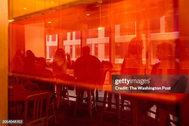 Single attendees participate in a shuffle speed dating event at Compass Coffee in Rosslyn, VA, on Saturday, March 2, 2024.