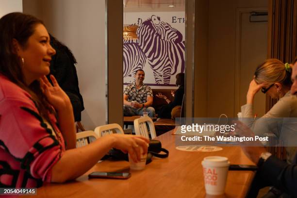 Single attendees chat during a seven-minute speed date during a shuffle speed dating event at Compass Coffee in Rosslyn, VA, on Saturday, March 2,...