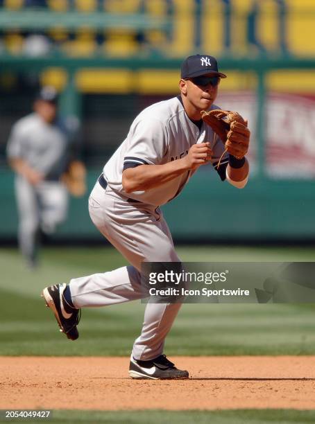 New York Yankees third baseman Alex Rodriguez moves towards a ground ball during an MLB baseball game against the Los Angeles Angels of Anaheim...