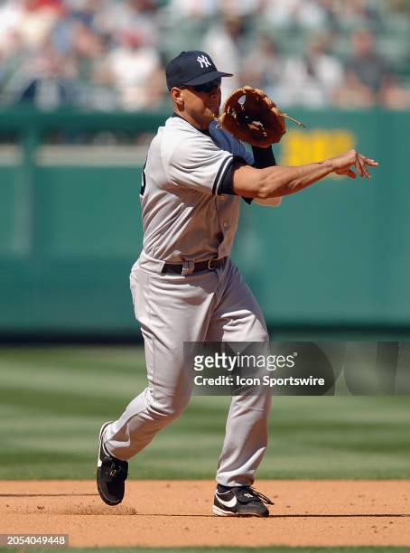 New York Yankees third baseman Alex Rodriguez throws to first base for an out during an MLB baseball game against the Los Angeles Angels of Anaheim...
