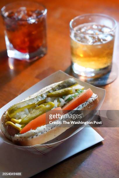 Drinks and a Chicago-style Hot Dog, which features beef and pork franks with sport peppers, sweet pickle relish, white onions, tomatoes, yellow...