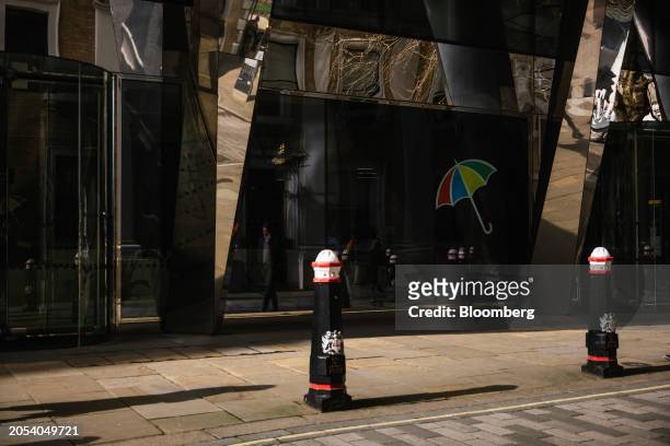 The Legal and General Group Plc logo in the window of their headquarters in the City of London, UK, on Tuesday, March 2024. Legal & General reported...