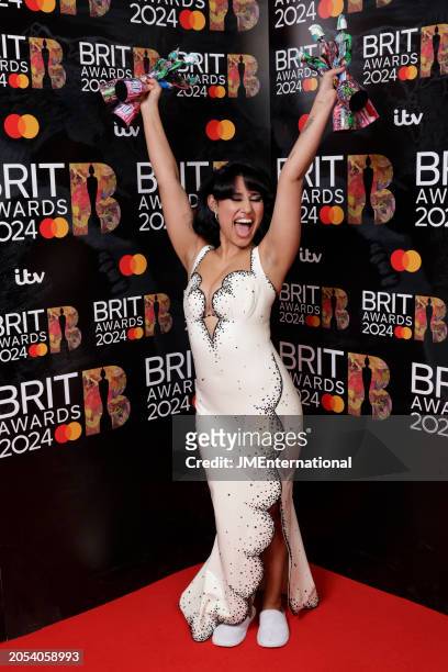 Raye poses with her 6 awards during the BRIT Awards 2024 at The O2 Arena on March 02, 2024 in London, England.