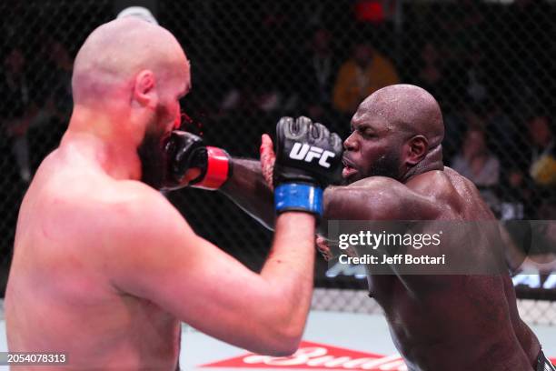 Jairzinho Rozenstruik of Suriname punches Shamil Gaziev of Russia in a heavyweight bout during the UFC Fight Night event at UFC APEX on March 02,...