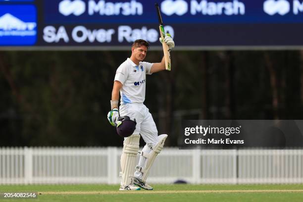 Daniel Hughes of New South Wales celebrates after reaching a century during the Sheffield Shield match between New South Wales and South Australia at...