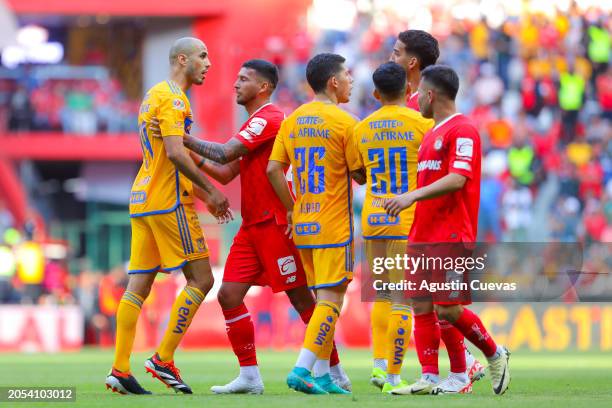 Guido Pizarro of Tigres and Jean Meneses of Toluca discuss during the 10th round match between Toluca and Tigres UANL as part of the Torneo Clausura...