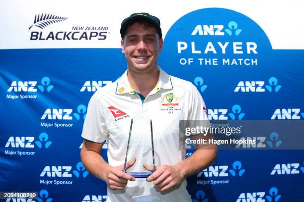 Cameron Green of Australia poses with the Player of the Match trophy during day four of the First Test in the series between New Zealand and...