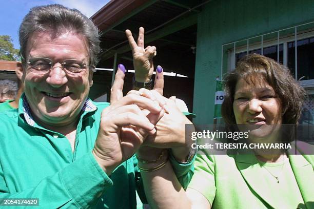 Costa Rican presidential candidate for the Partido Liberacion Nacional , Rolando Araya and his wife Leny Polonio, are seen gesturing with their...