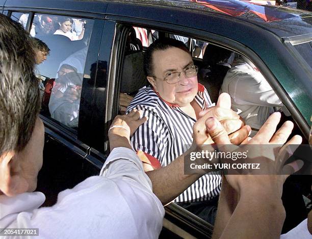 Presidential candidate for the Partido Unidad Social Cristiana , Abel Pacheco, greets supporters during the election in San Jose, Costa Rica, 03...