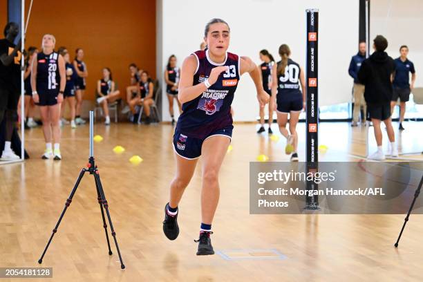 Olive Mclean of the Dragons completes a drill during a Coates Talent League Girls Testing exercise on March 03, 2024 in Melbourne, Australia.