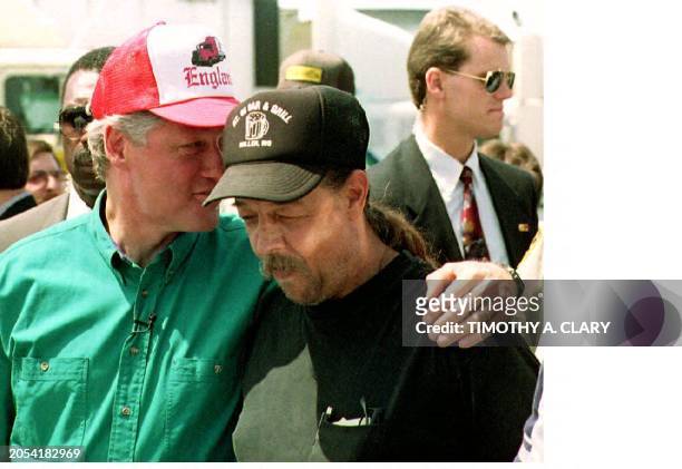 Democratic presidential candidate Bill Clinton talks to truck driver Robert Creekmore 18 July during a campain stop at the All-American Truck Stop in...