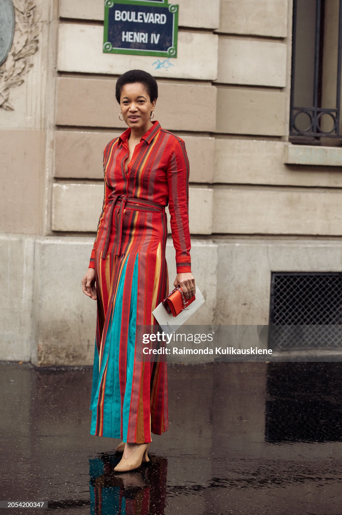 paris-france-tamu-mcpherson-wears-long-red-blue-and-orange-maxi-button-up-dress-with-a-belt.jpg
