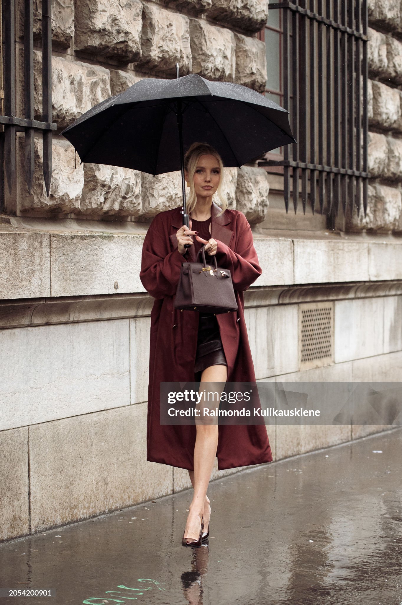 paris-france-leonie-hanne-wears-a-brown-bag-burgundy-coat-burgundy-leather-mini-skirt-burgundy.jpg