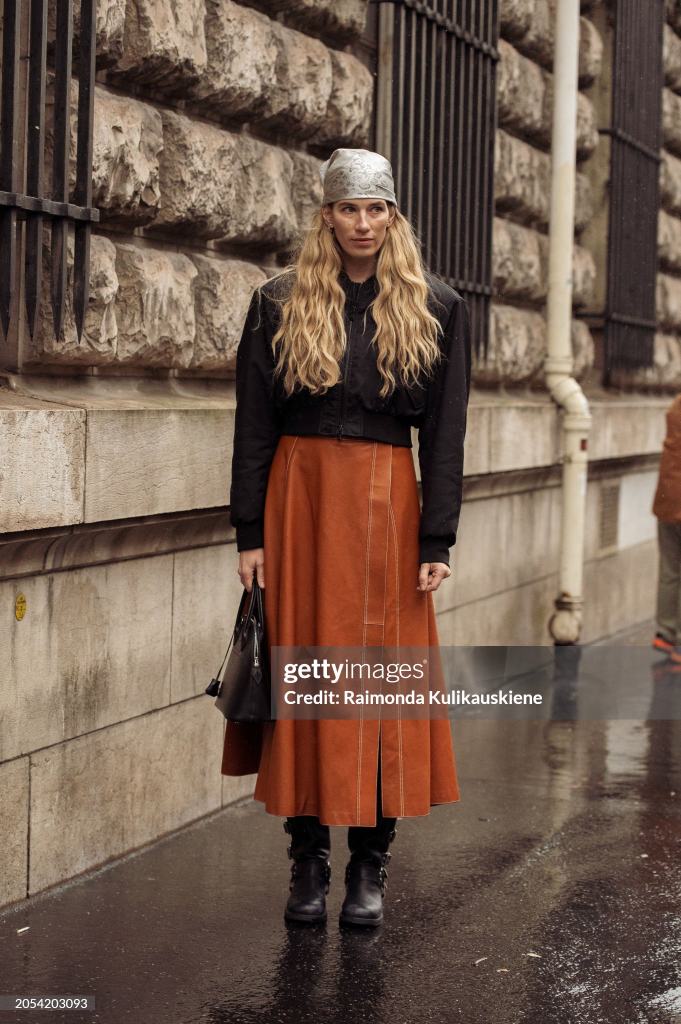 paris-france-veronika-heilbrunner-wears-a-long-brown-leather-skirt-with-a-split-black-cropped.jpg