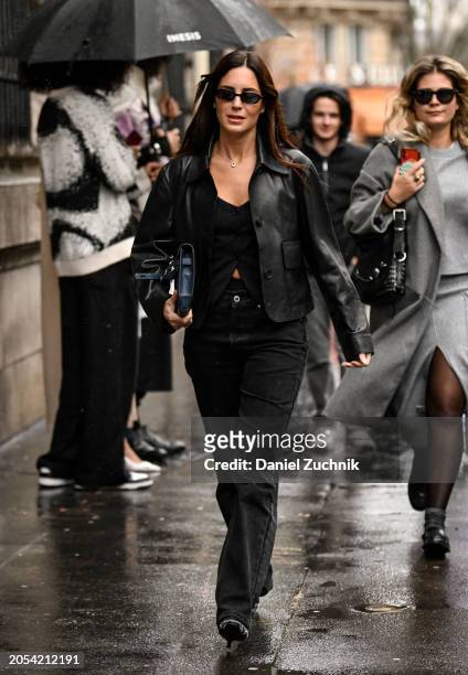 Gala Gonzalez is seen wearing a black Hermes jacket, black top, black jeans, black and silver heels, black sunglasses and a blue Hermes bag outside...