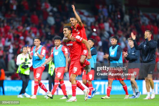 Andres Pereira of Toluca and Brian Garcia of Toluca celebrate after the 10th round match between Toluca and Tigres UANL as part of the Torneo...