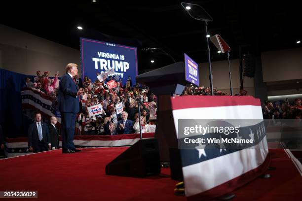 Republican presidential candidate and former President Donald Trump reacts to supporters while arriving on stage during a Get Out the Vote Rally...