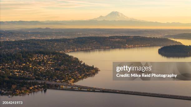 aerial above lake washington mercer island and i90 bridge mount rainier - mt rainier stock pictures, royalty-free photos & images
