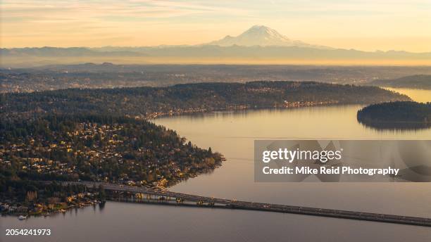 aerial above lake washington mercer island and i90 bridge mount rainier - lake washington stock pictures, royalty-free photos & images