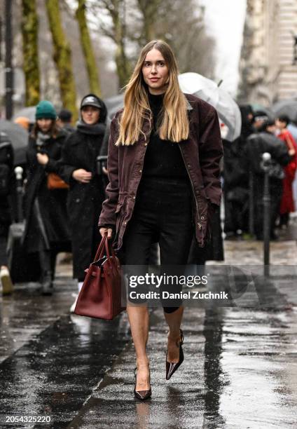 Pernille Teisbaek is seen wearing a maroon jacket, black top, black shorts, black heels and maroon Hermes bag outside the Hermes show during the...