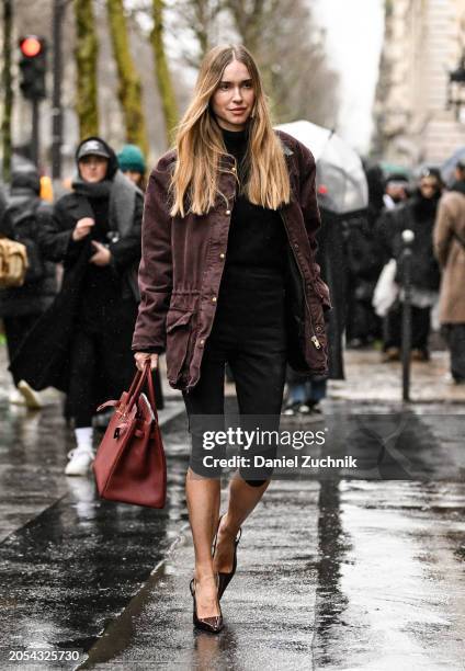 Pernille Teisbaek is seen wearing a maroon jacket, black top, black shorts, black heels and maroon Hermes bag outside the Hermes show during the...