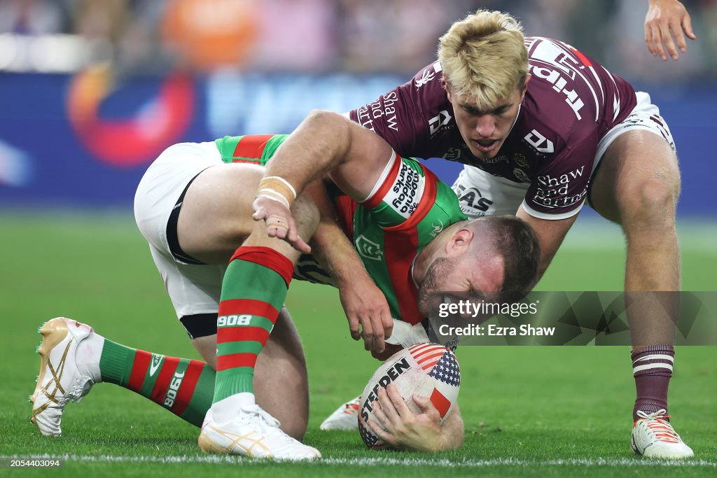 Jai Rabbithoes Jai Arrow of the Rabbitohs is tackled by Ben Trbojevic of the Sea ...